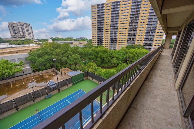 3831 Turtle Creek Blvd Unit 7E, Dallas, TX 75219 - balcony with a tennis court and a city view