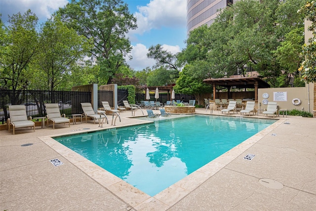 3831 Turtle Creek Blvd Unit 7E, Dallas, TX 75219 - pool featuring a patio, fence, and a pergola