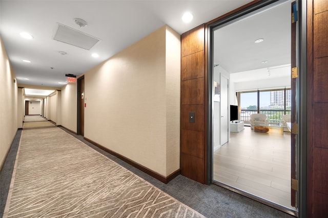 3831 Turtle Creek Blvd Unit 7E, Dallas, TX 75219 - hall with recessed lighting, baseboards, carpet flooring, and attic access