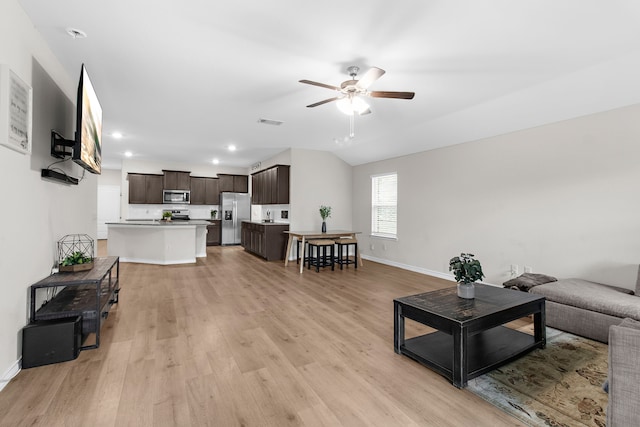 4016 Glastonbury Rd, Mckinney, TX 75071 - living room featuring baseboards, a ceiling fan, light wood-style flooring, and recessed lighting