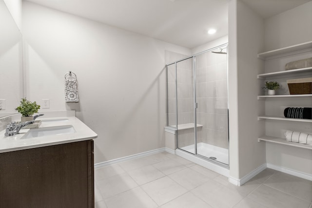 4016 Glastonbury Rd, Mckinney, TX 75071 - full bath with double vanity, a sink, tile patterned floors, and a stall shower