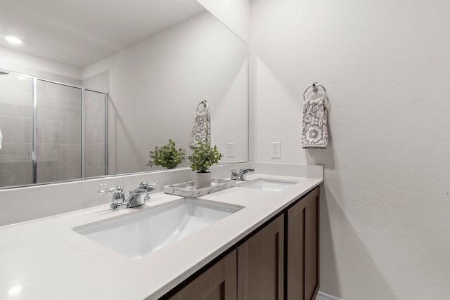 4016 Glastonbury Rd, Mckinney, TX 75071 - bathroom featuring double vanity, a sink, and tiled shower