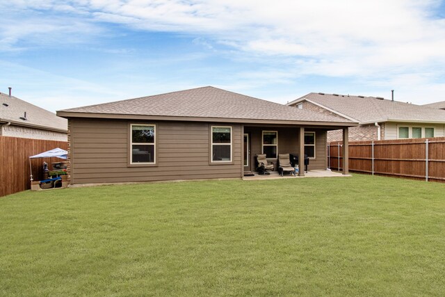 4016 Glastonbury Rd, Mckinney, TX 75071 - rear view of property featuring a fenced backyard, a patio, a shingled roof, and a yard