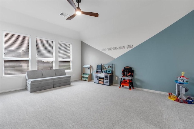 recreation room featuring carpet floors, ceiling fan, lofted ceiling, and visible vents