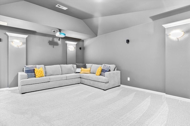 cinema room with carpet flooring, baseboards, vaulted ceiling, and visible vents