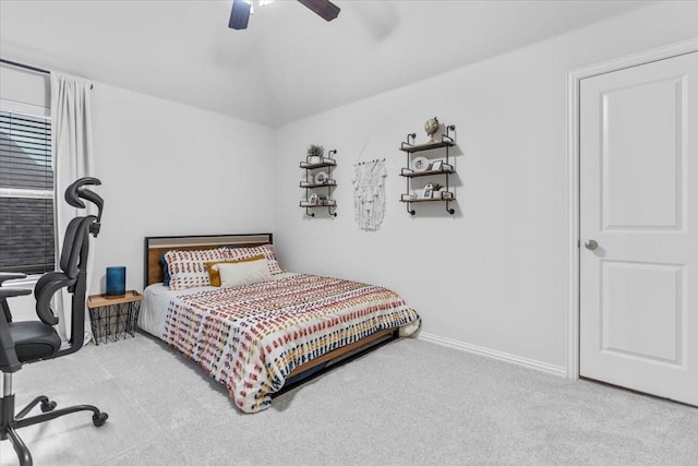 bedroom featuring carpet floors, baseboards, and ceiling fan