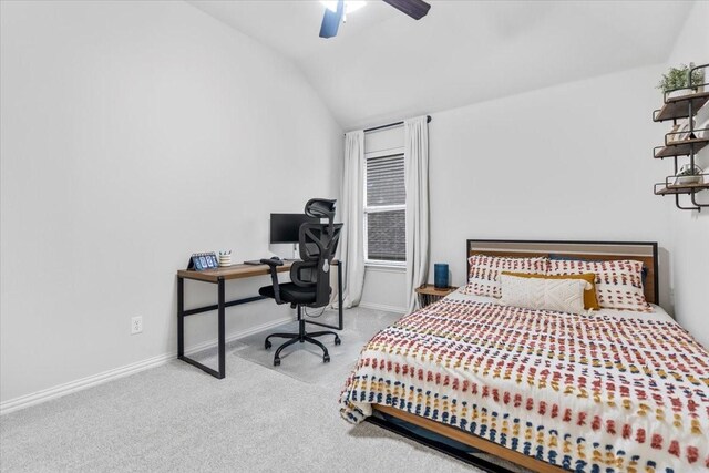 carpeted bedroom featuring baseboards, ceiling fan, and vaulted ceiling