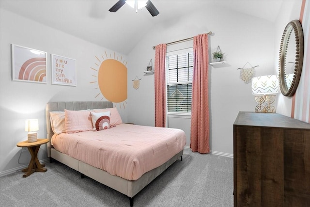 carpeted bedroom with a ceiling fan, baseboards, and lofted ceiling