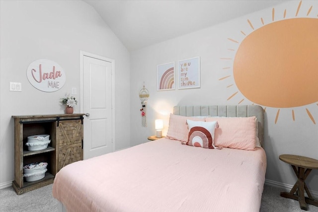 bedroom with baseboards, carpet flooring, and lofted ceiling