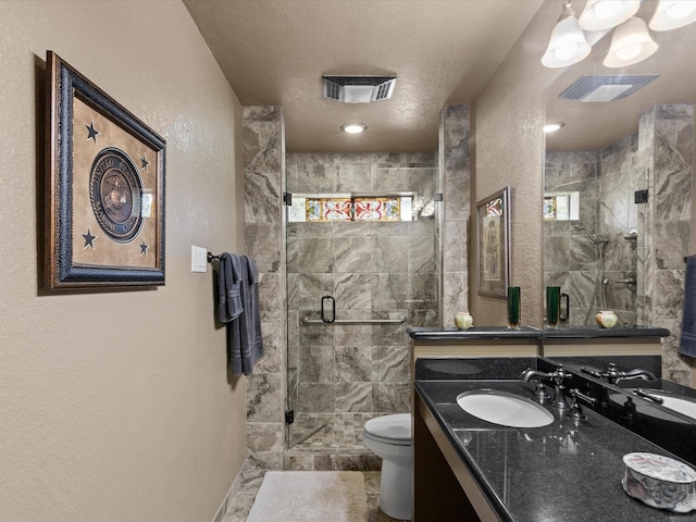 full bathroom featuring visible vents, a textured wall, toilet, and a shower stall