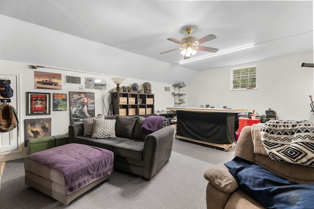 living area featuring carpet flooring, ceiling fan, visible vents, and lofted ceiling