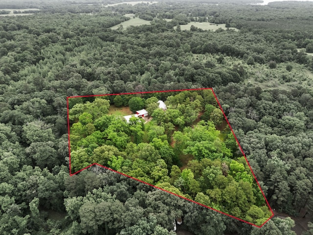 aerial view featuring a view of trees