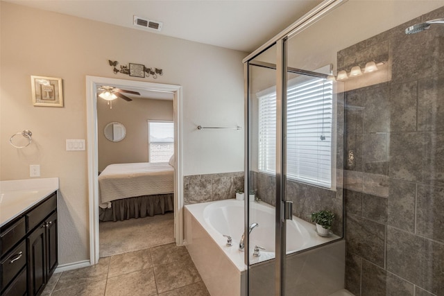 ensuite bathroom with ceiling fan, a garden tub, visible vents, vanity, and ensuite bathroom