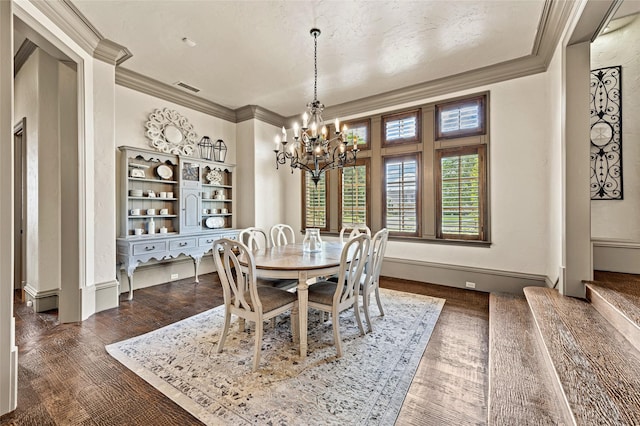 1237 Wales Dr, Mclendon Chisholm, TX 75032 - dining room featuring a chandelier, crown molding, and dark wood-style flooring