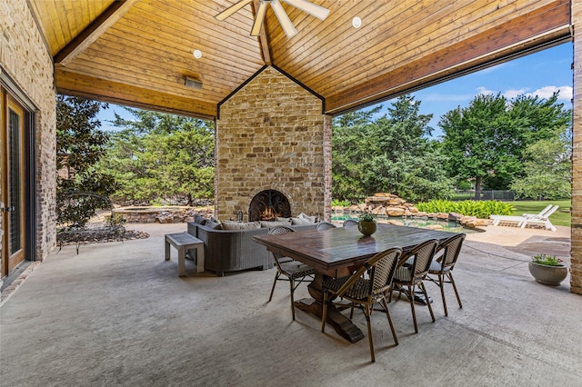 1237 Wales Dr, Mclendon Chisholm, TX 75032 - view of patio with an outdoor brick fireplace, ceiling fan, view of scattered trees, and outdoor dining area