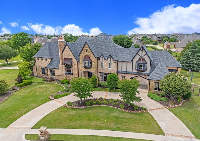 1237 Wales Dr, Mclendon Chisholm, TX 75032 - tudor home with a chimney, a front yard, stone siding, and a residential view