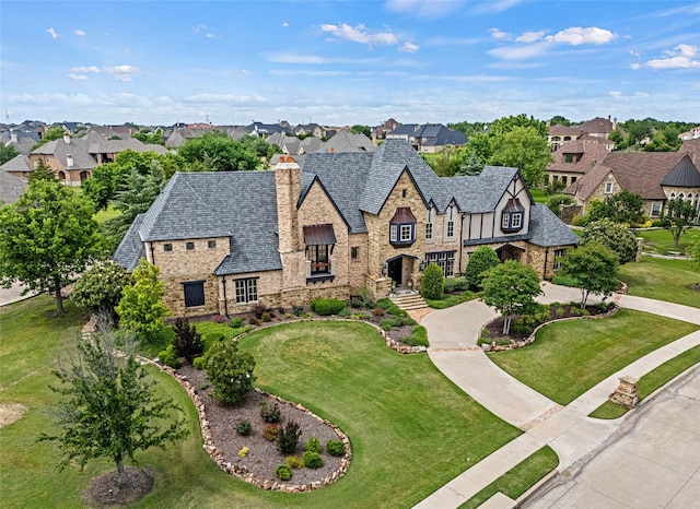 1237 Wales Dr, Mclendon Chisholm, TX 75032 - tudor home featuring stone siding, a residential view, and a chimney