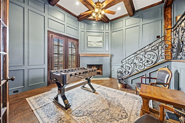 1237 Wales Dr, Mclendon Chisholm, TX 75032 - playroom with a decorative wall, a ceiling fan, a fireplace with flush hearth, beamed ceiling, and recessed lighting