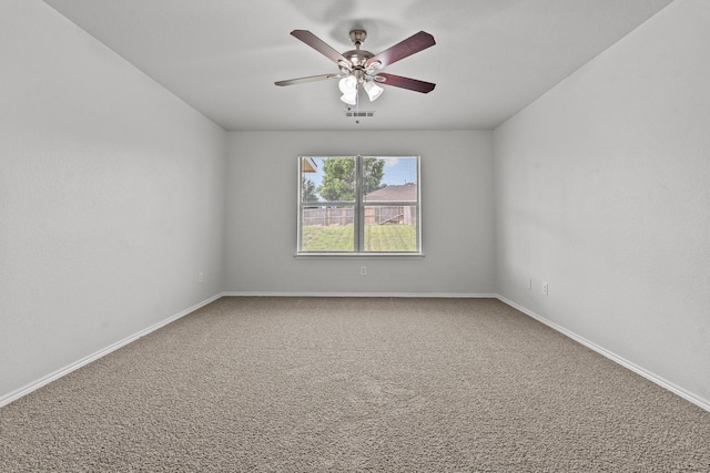 unfurnished room featuring visible vents, carpet flooring, baseboards, and ceiling fan