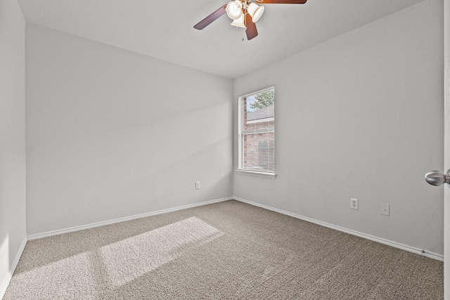 empty room with baseboards, carpet, and a ceiling fan