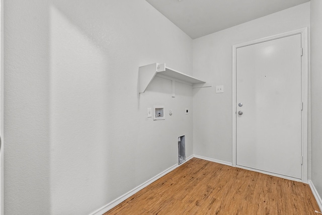 laundry room with gas dryer hookup, laundry area, light wood-type flooring, baseboards, and hookup for a washing machine