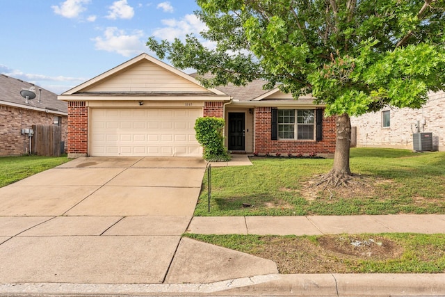 single story home with a garage, fence, a front yard, brick siding, and driveway