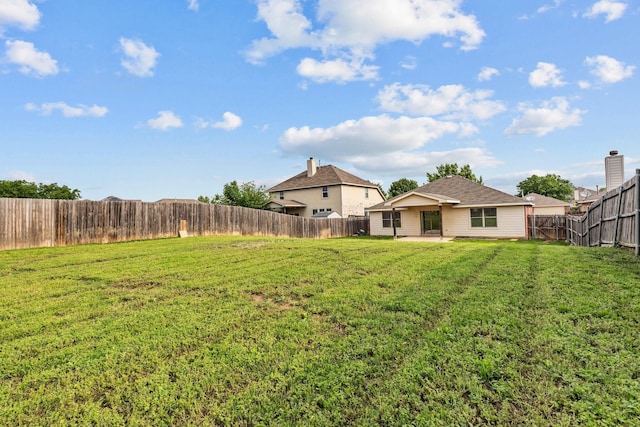 view of yard with a patio and a fenced backyard