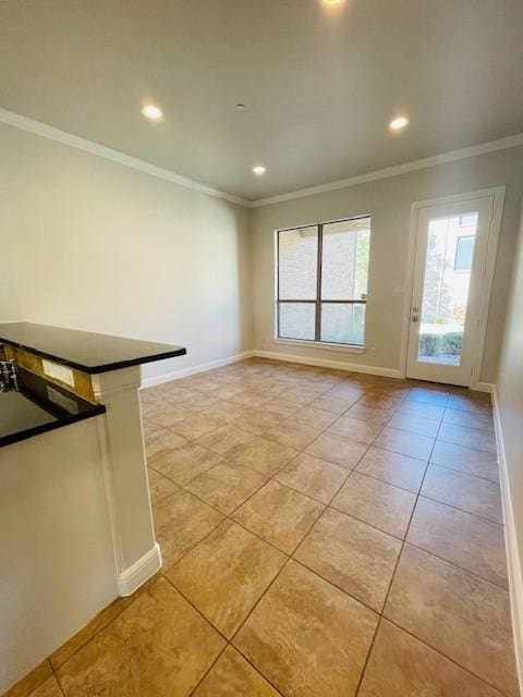interior space with recessed lighting, ornamental molding, baseboards, and light tile patterned flooring