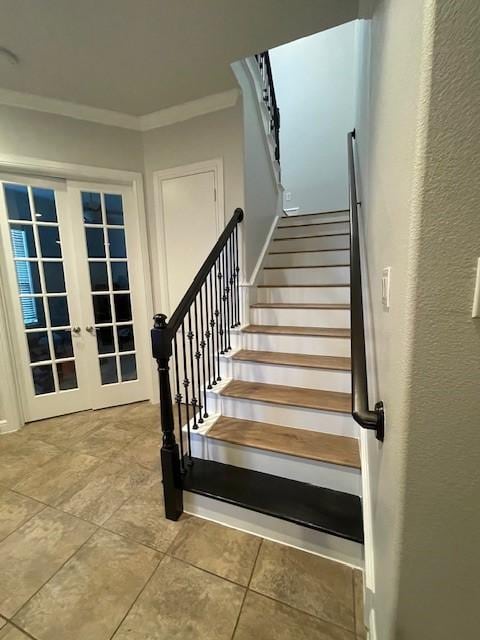 stairs featuring french doors, crown molding, and tile patterned flooring
