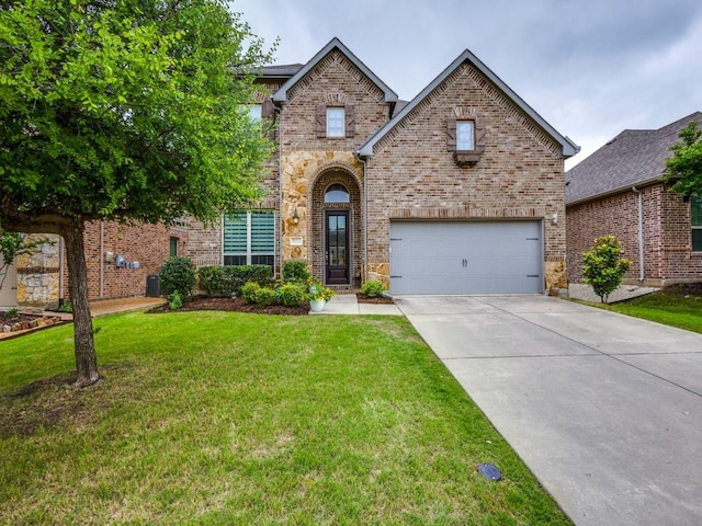 5517 Grove Cove Dr, Mckinney, TX 75071 - traditional-style house with stone siding, a garage, brick siding, a front yard, and driveway