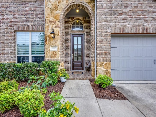 5517 Grove Cove Dr, Mckinney, TX 75071 - view of exterior entry featuring stone siding and brick siding