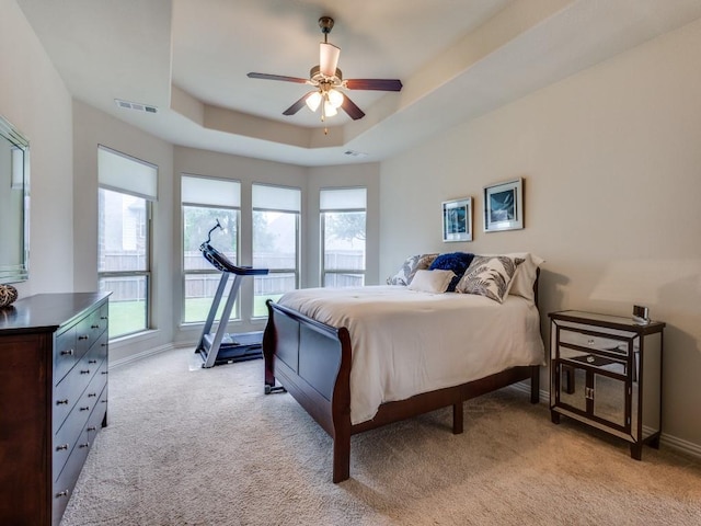 5517 Grove Cove Dr, Mckinney, TX 75071 - bedroom with visible vents, a raised ceiling, baseboards, and light carpet