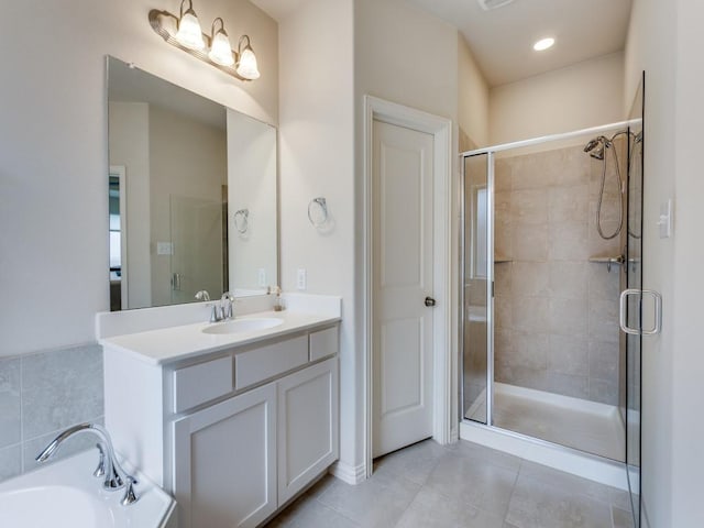 5517 Grove Cove Dr, Mckinney, TX 75071 - bathroom with vanity, tile patterned floors, a stall shower, and a tub to relax in