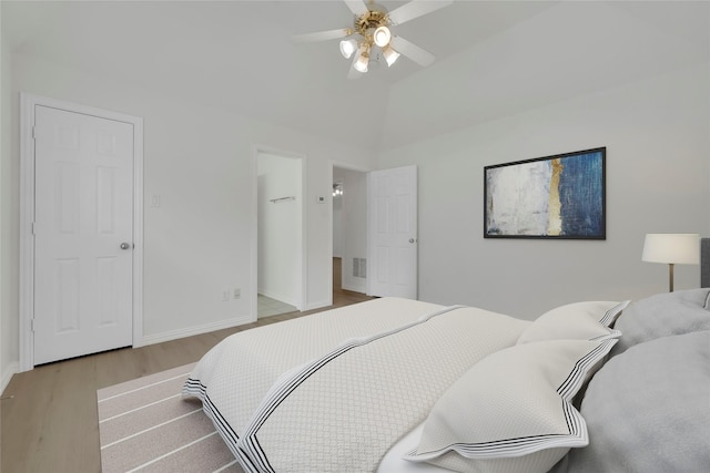 bedroom featuring wood finished floors, baseboards, and ceiling fan