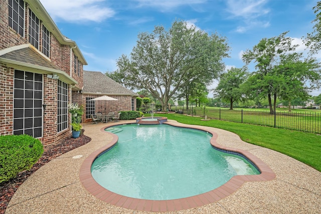 view of swimming pool with a patio area and a pool with connected hot tub