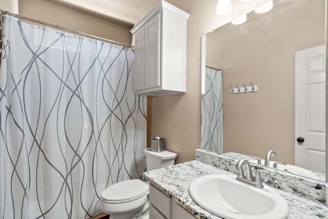 1185 Shores Blvd, Rockwall, TX 75087 - full bath with toilet, a textured wall, a shower with curtain, and vanity