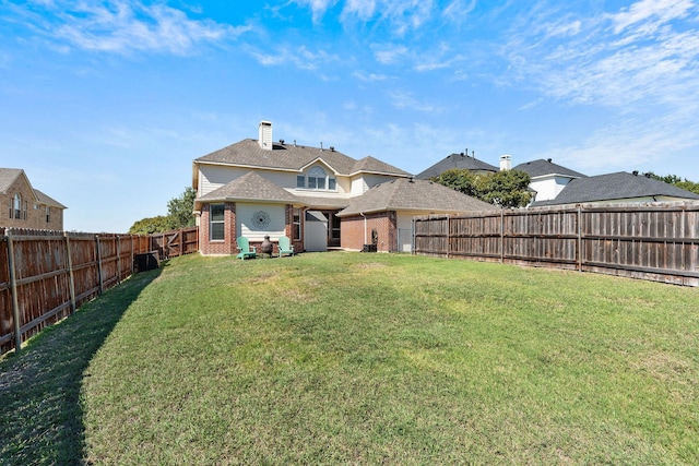 1185 Shores Blvd, Rockwall, TX 75087 - rear view of property with a fenced backyard, a chimney, a lawn, and brick siding