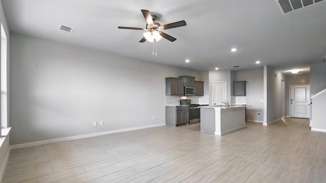 kitchen with visible vents, open floor plan, and stainless steel appliances