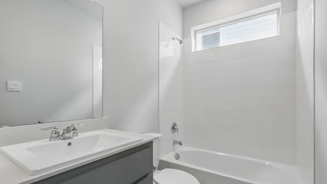bathroom with vanity, toilet, and shower / tub combination