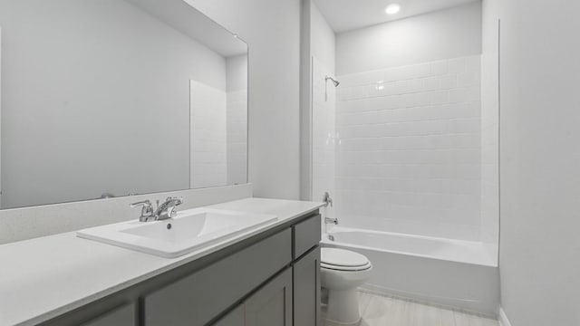 full bath featuring toilet, recessed lighting, bathing tub / shower combination, and vanity