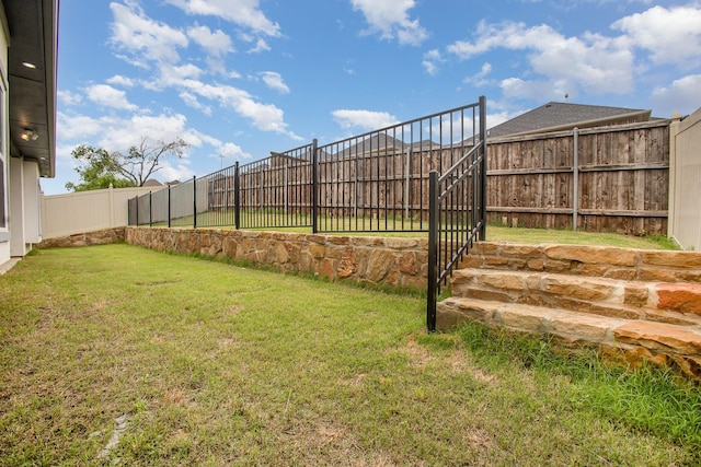 view of yard featuring a fenced backyard
