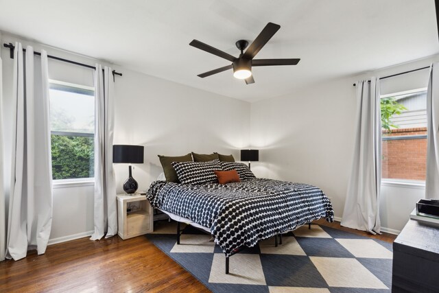 3049 Rotan Ln, Dallas, TX 75229 - bedroom with baseboards, ceiling fan, and wood finished floors