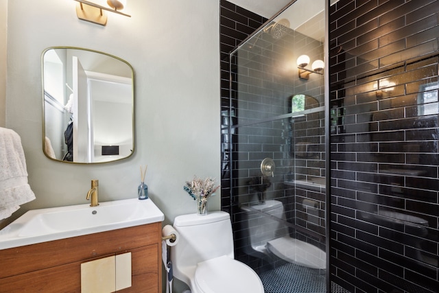 3049 Rotan Ln, Dallas, TX 75229 - bathroom with toilet, tiled shower, and vanity