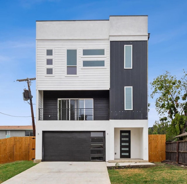 1922 Annex Ave, Dallas, TX 75204 - modern home featuring an attached garage, concrete driveway, stucco siding, and a balcony