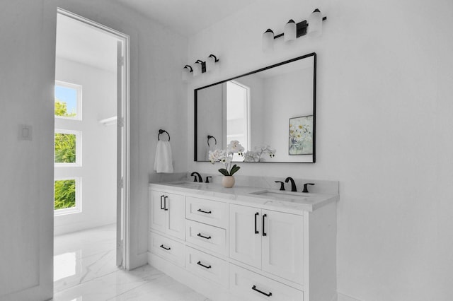 1922 Annex Ave, Dallas, TX 75204 - full bath with double vanity, a sink, and marble finish floor