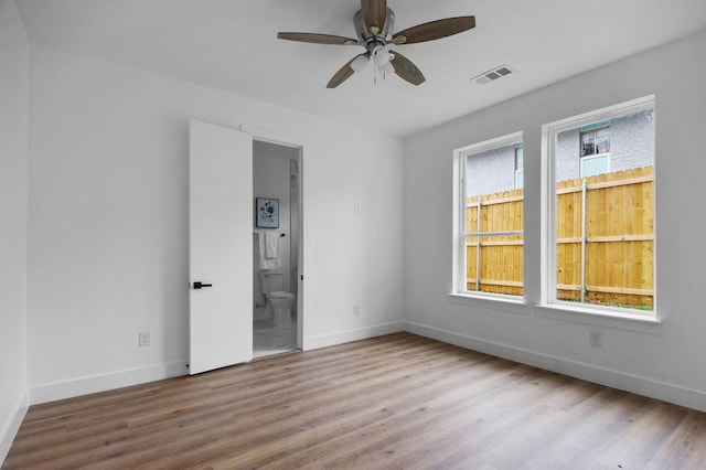 1922 Annex Ave, Dallas, TX 75204 - unfurnished bedroom with baseboards, visible vents, and wood finished floors