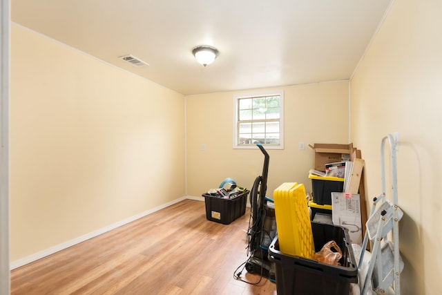 home office featuring baseboards, visible vents, and light wood-style floors
