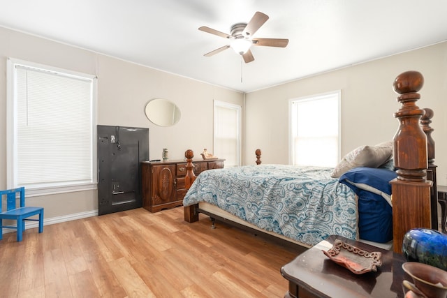 bedroom with baseboards, light wood-style flooring, and ceiling fan