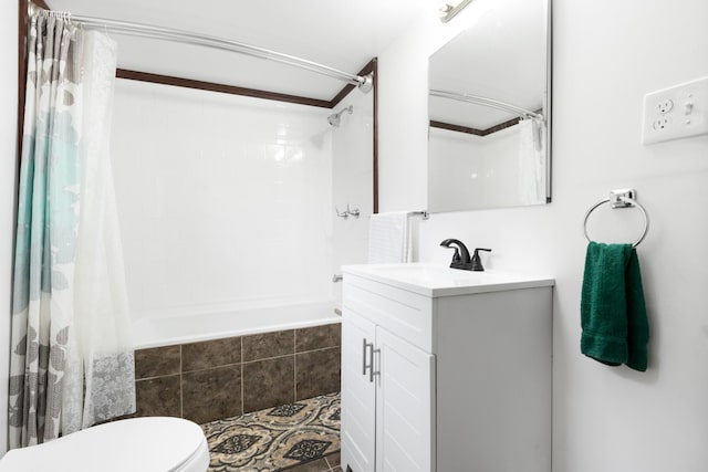 full bath with vanity, tile patterned floors, tiled shower / bath, and toilet