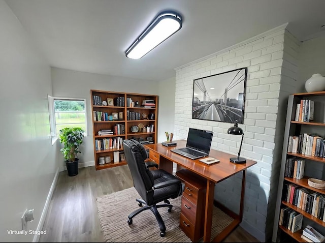 home office with wood finished floors and baseboards